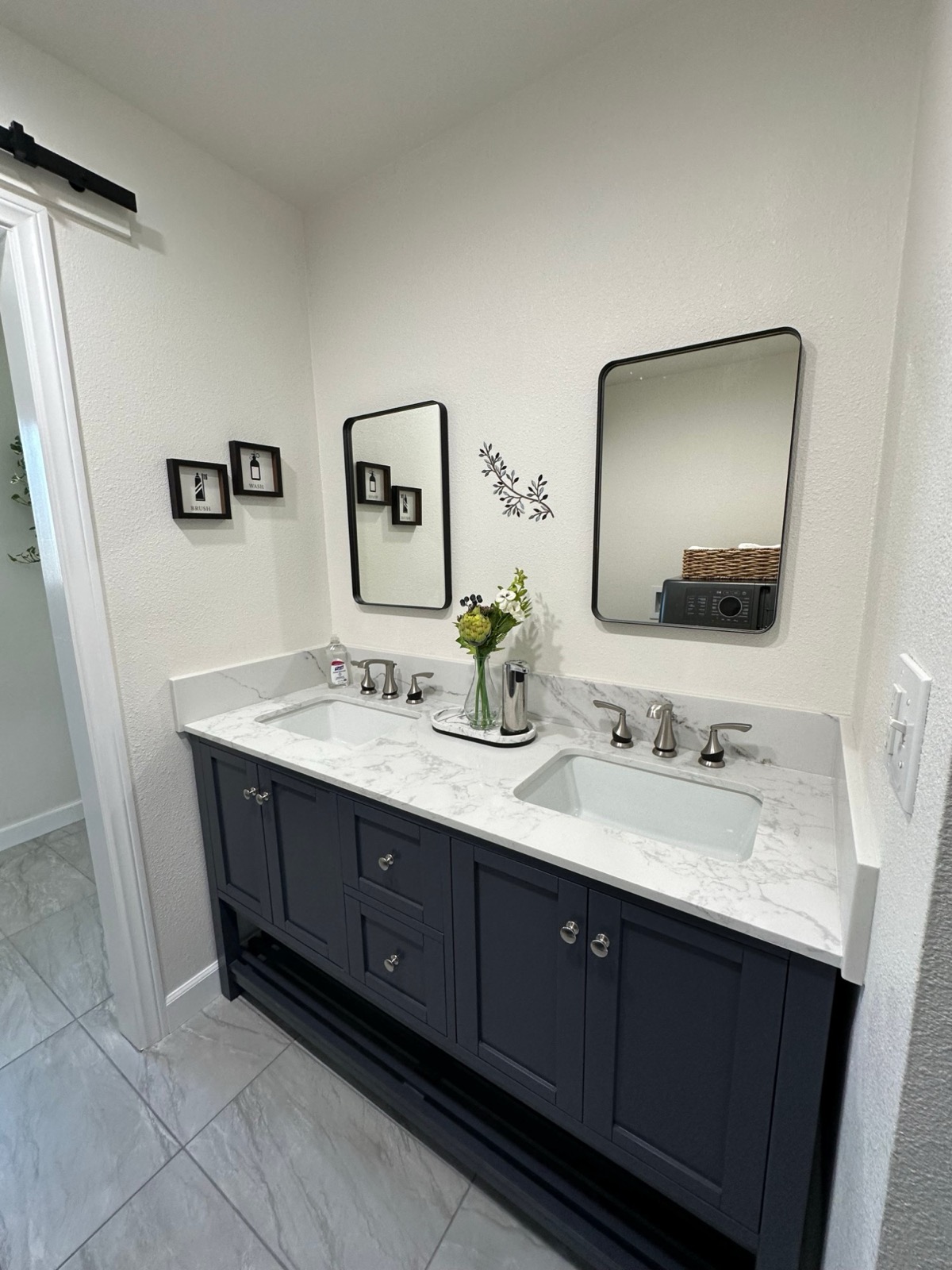 Bathroom with double vanity and marble countertop